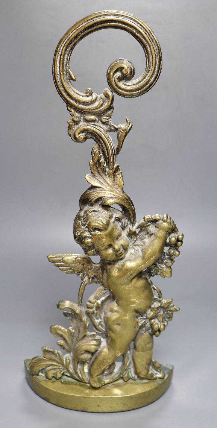 A Victorian brass cherub door stop, height 49cm